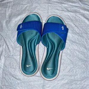 Blue nike memory foam slides